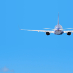 Passenger jet airliner plane arriving flying into Miami Internat