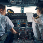 Pilot and female first officer seated in the flight deck