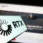Stuttgart, Germany - 08-06-2023: Mobile phone with logo of US aerospace and defense company RTX Corporation on screen in front of website. Focus on center-left of phone display.