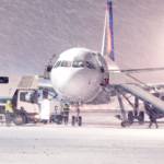 commercial airplane parking at the airport in winter