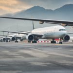 Due to Coronavirus Covid-19 airline fleet parked at the taxiway