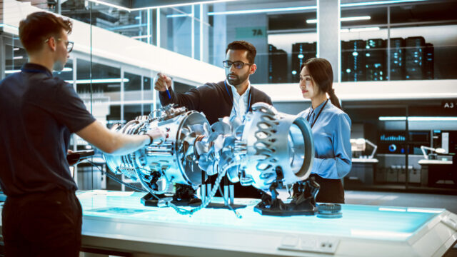 Young Team of Multicultural Engineers Use Blueprints, Tablet and Laptop Computers, Analyze and Discuss How a Modern Electric Turbine Motor Works. High Tech Research Laboratory with Modern Equipment.; Shutterstock ID