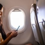 Woman traveling with airplane.