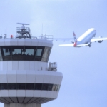 Gatwick Airport, Control tower with aircraft in flight in background, DP, 19 August 2004, (CGA857)