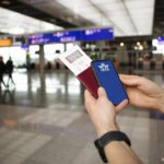 IATA Travel Pass Initiative. Phone in airport and airplane in th