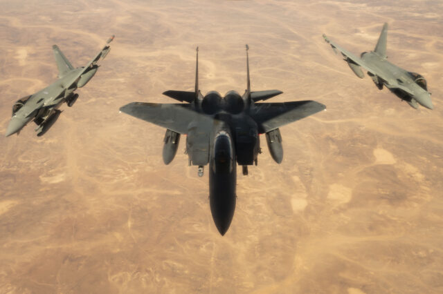 RAF eurofighter Typhoon and USAF F-15E fly together