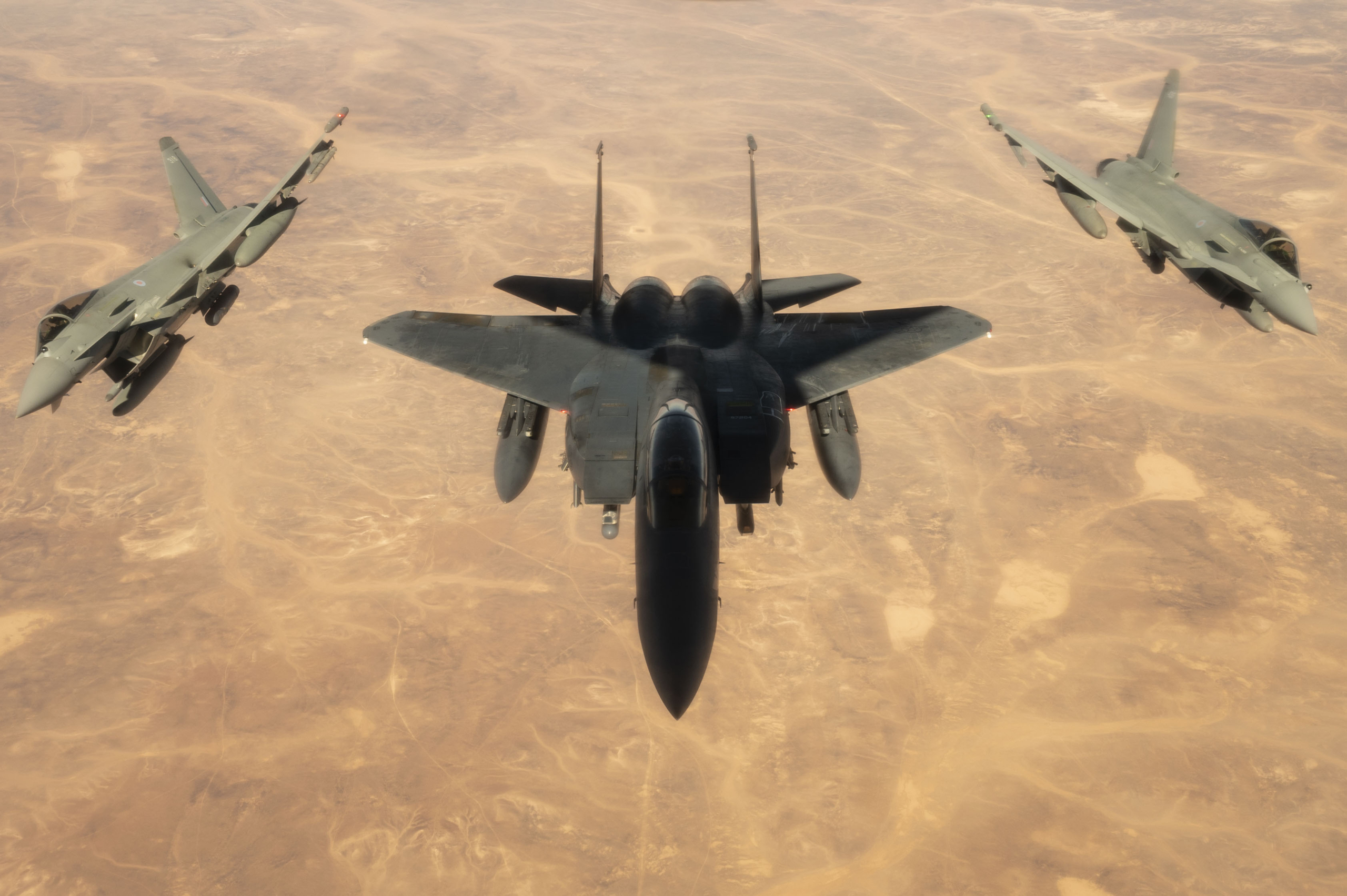 RAF eurofighter Typhoon and USAF F-15E fly together