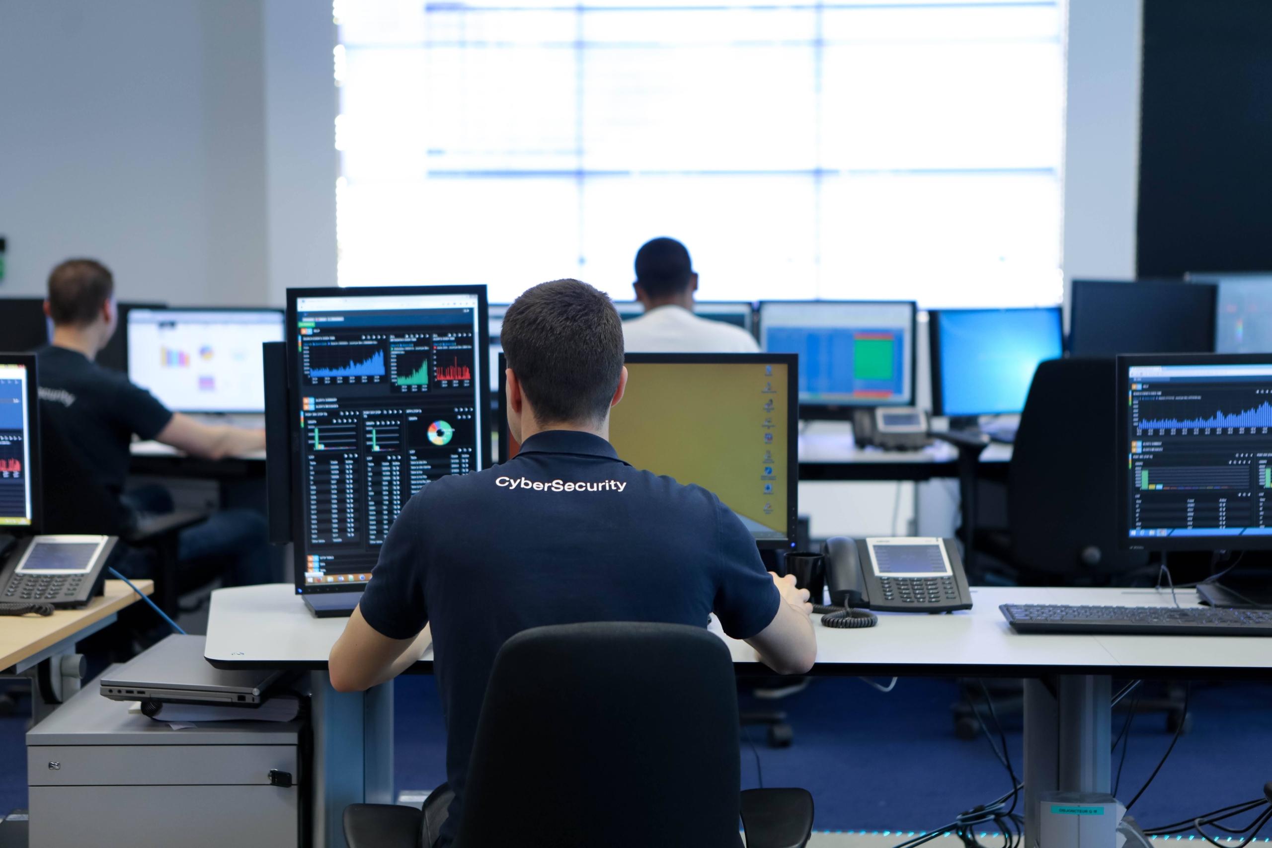 A cybersecurity analyst wearing a 