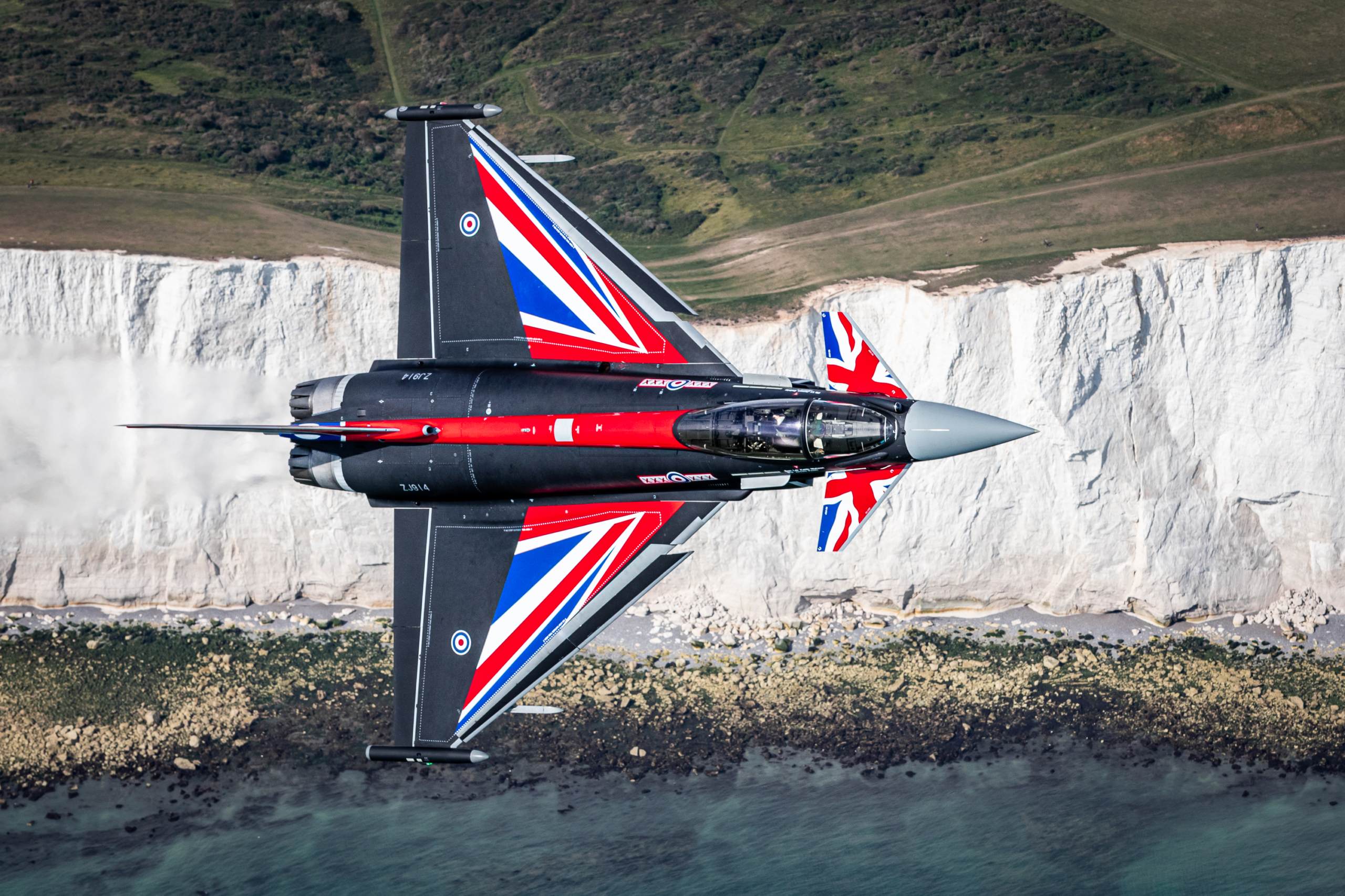 The RAF Typhoon Display Team aircraft, BLACKJACK, piloted by Flt Lt Sainty flying over the iconic White Cliffs of southern British coastline ahead of the anniversary of the Battle of Britain.
