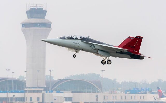 The T-7A Red Hawk flying past a control tower 2