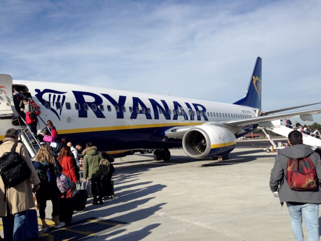 Passengers boarding Ryanair plane front and back.