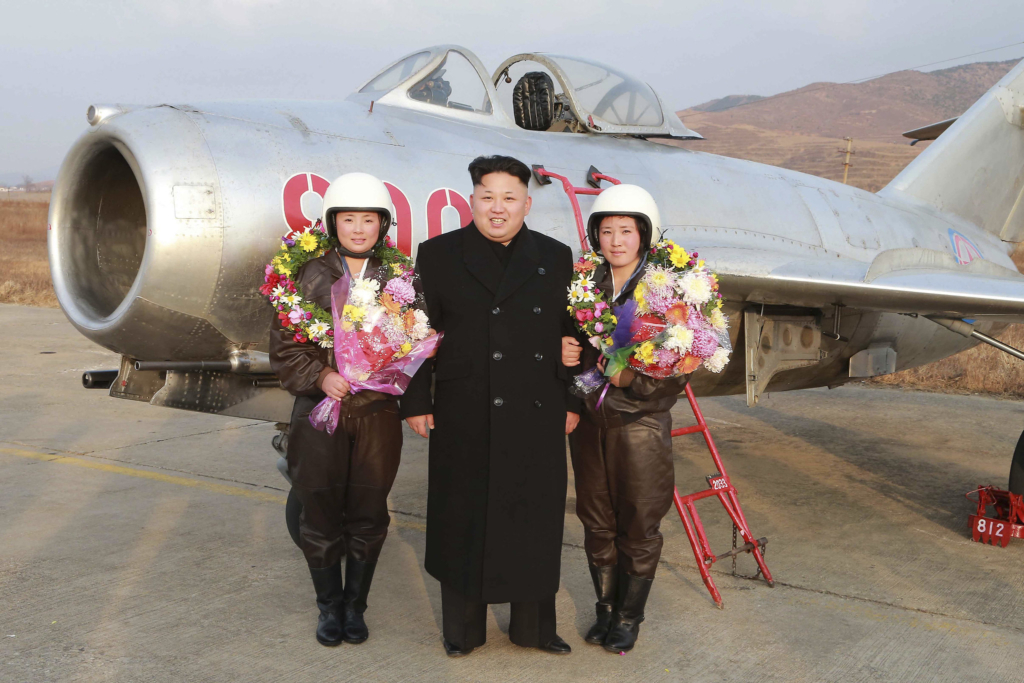 Kim Jong Un poses in front of a MiG-15