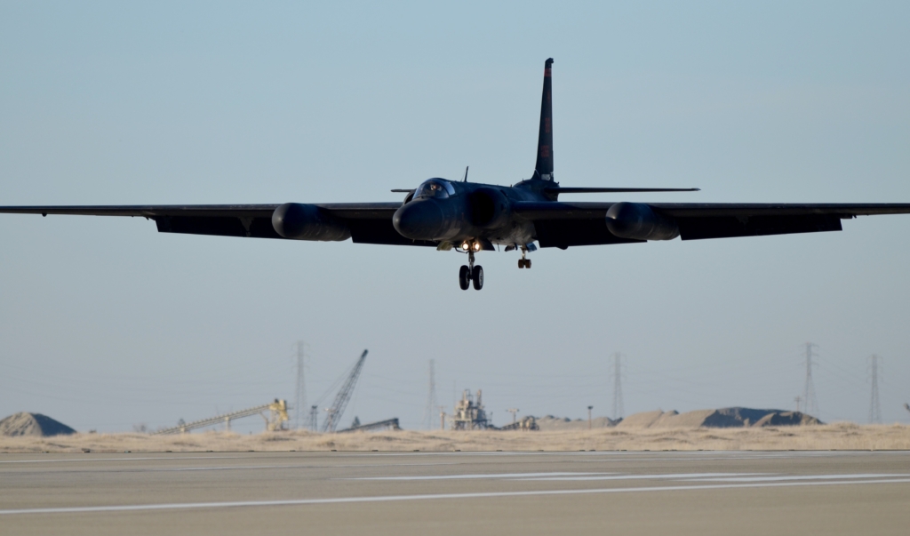A U-2 Dragon Lady soars above the flightline at Beale Air Force Base
