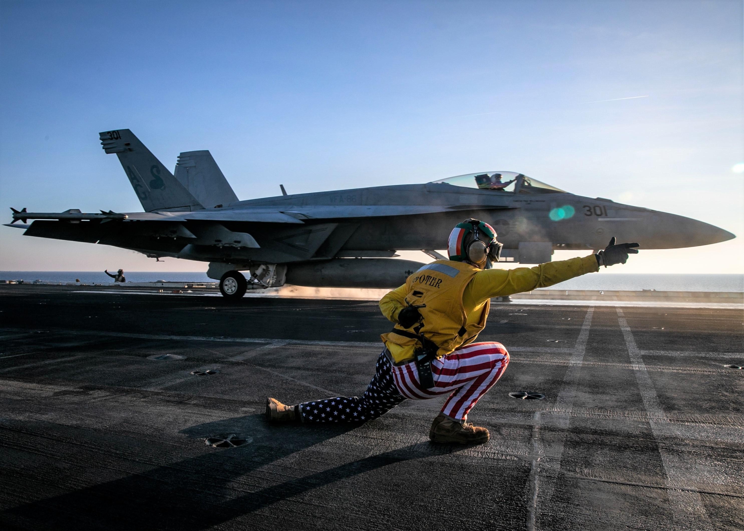 US Navy F/a-18 launching from a carrier