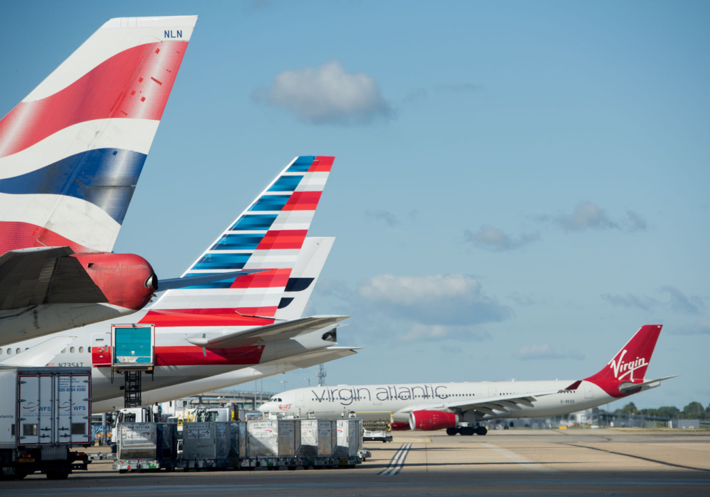Various aircraft in a row at Heathrow Airport