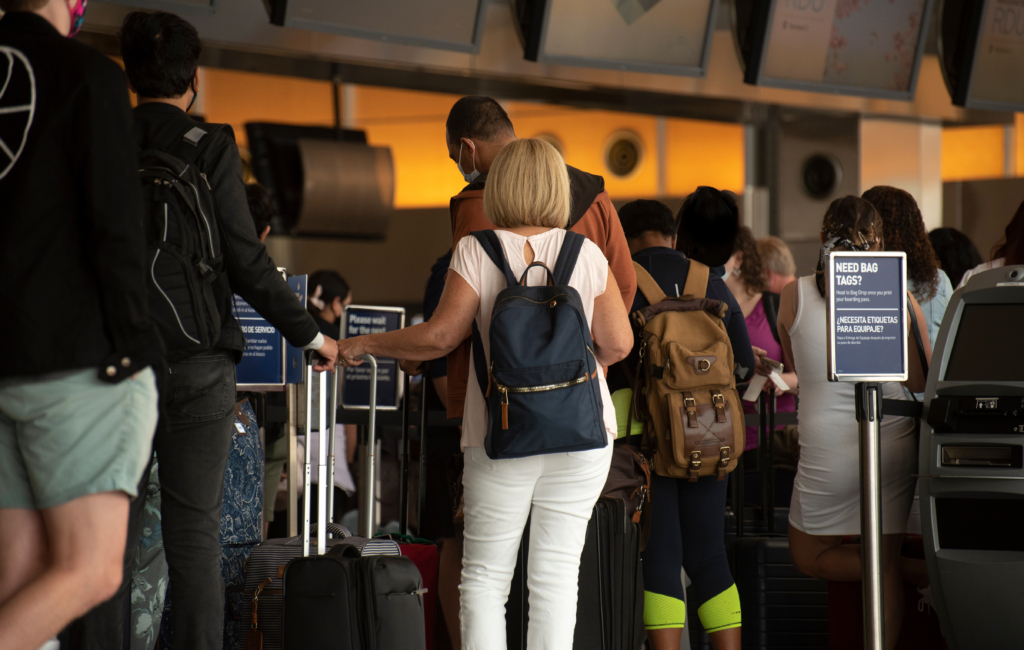 Airline passengers stand in long lines for check in on Memorial Day weekend at RDU International airport.