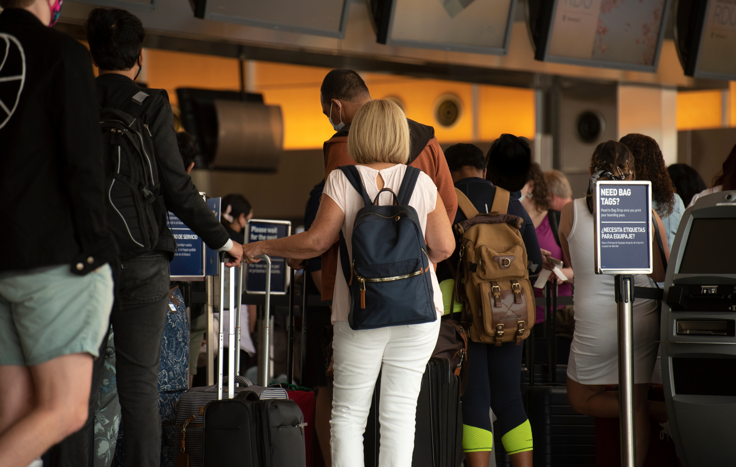 Airline passengers stand in long lines for check in on Memorial Day weekend at RDU International airport.