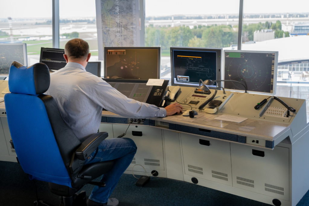 Air traffic controller workplace. Work space of the manager of takeoffs and landings of aircraft at the airport in tower. Monitors, chairs, computers. Air control center office.