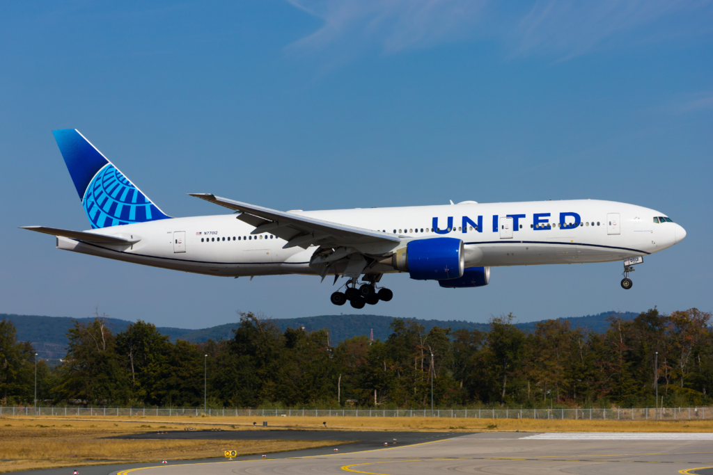United Boeing 777-200ER airplane short final above runway 07L threshold of Frankfurt Airport, Germany; August 24, 2022