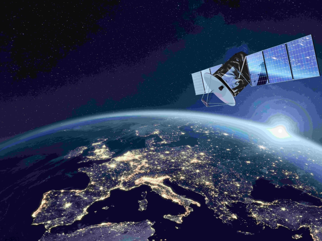 Telecommunication satellite providing global internet network and high speed data communication above Europe. Satellite in space, low Earth orbit. Worldwide communication technology.