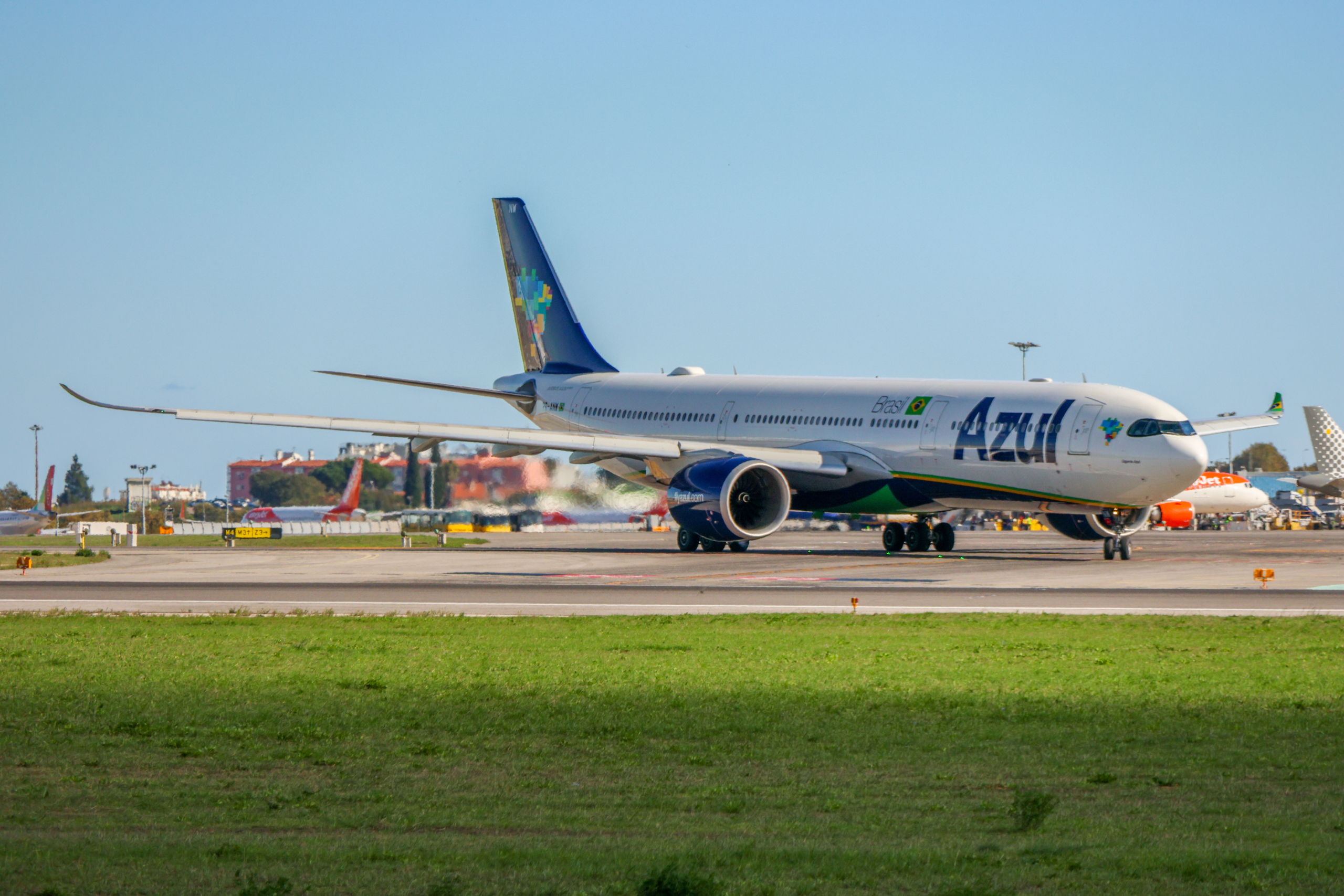 Azul linhas aereas brasileiras airbus a330 taxiing on the runway at lisbon humberto delgado airport, portugal