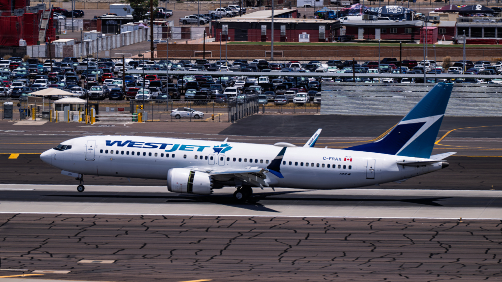 Sky Harbor Airport 7-6-2025 Phoenix AZ USA. WestJet Airlines Boeing 737-Max8 C-FRAX arrival into Phoenix Sky Harbor Intl. Airport.