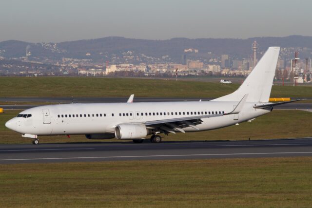White Boeing 737-800 airplane on the runway