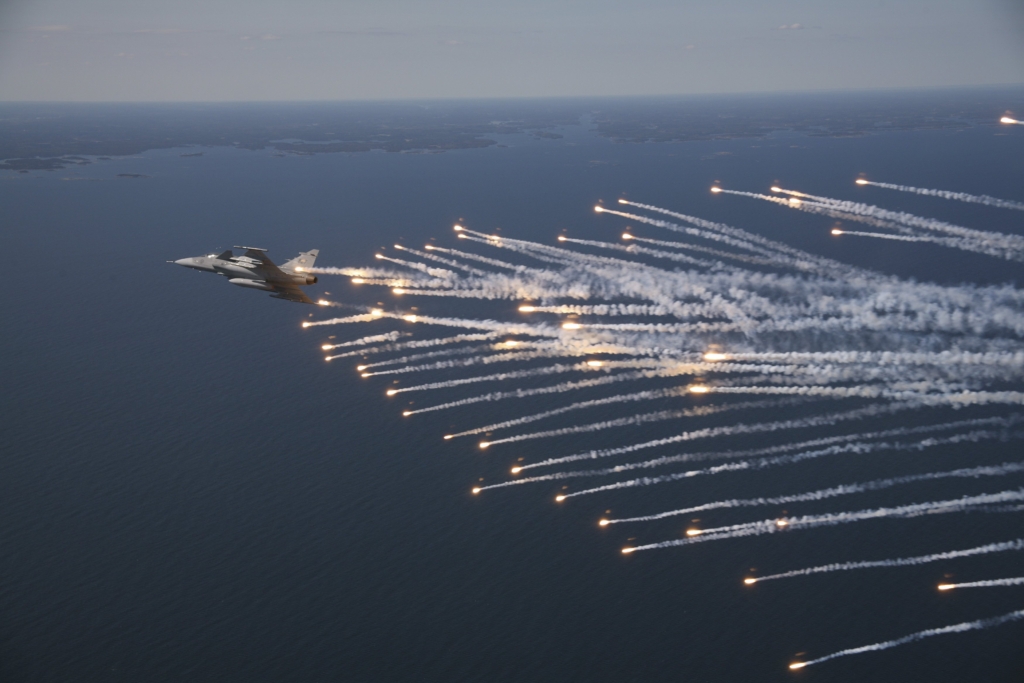 Gripen fighter jet with flares