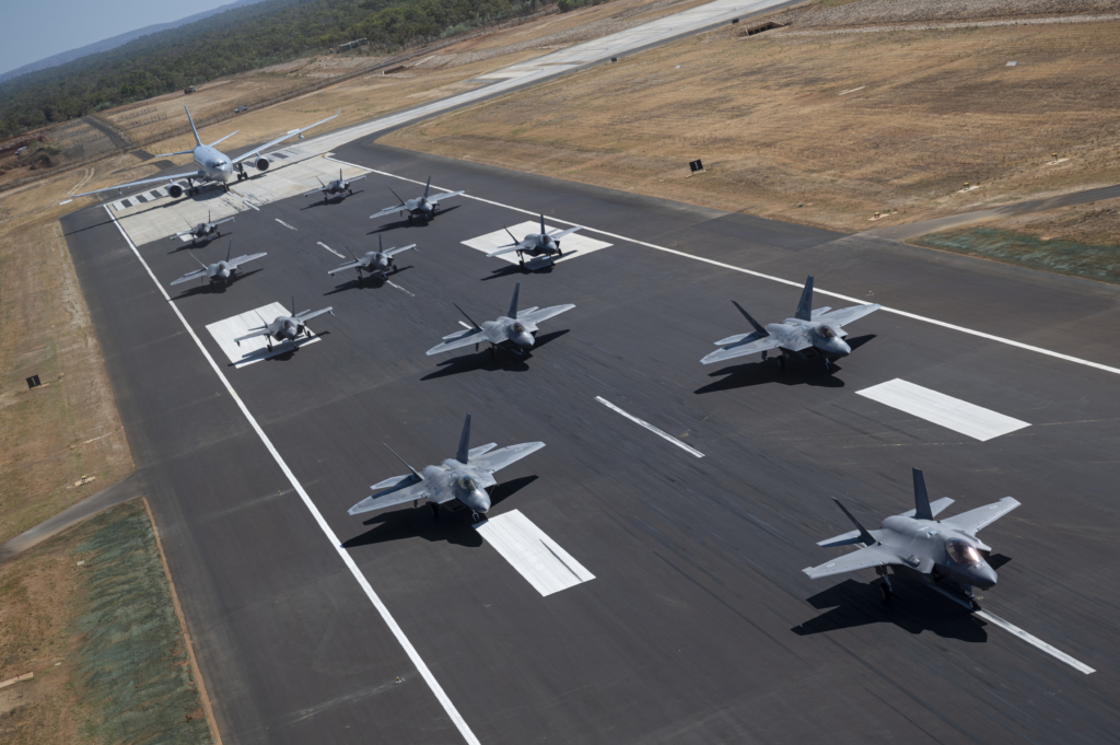 U.S. Air Force F-22A Raptors assigned to the 27th Expeditionary Fighter Squadron along with Royal Australian Air Force F-35A Lightning IIs
