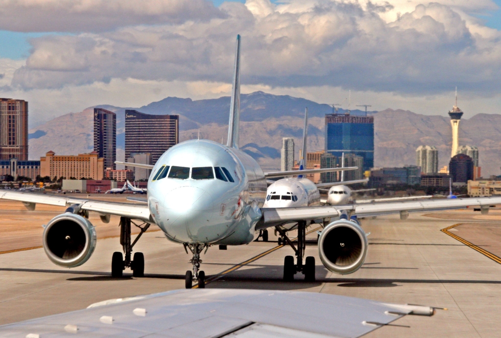 Jets line up for takeoff at a busy airport