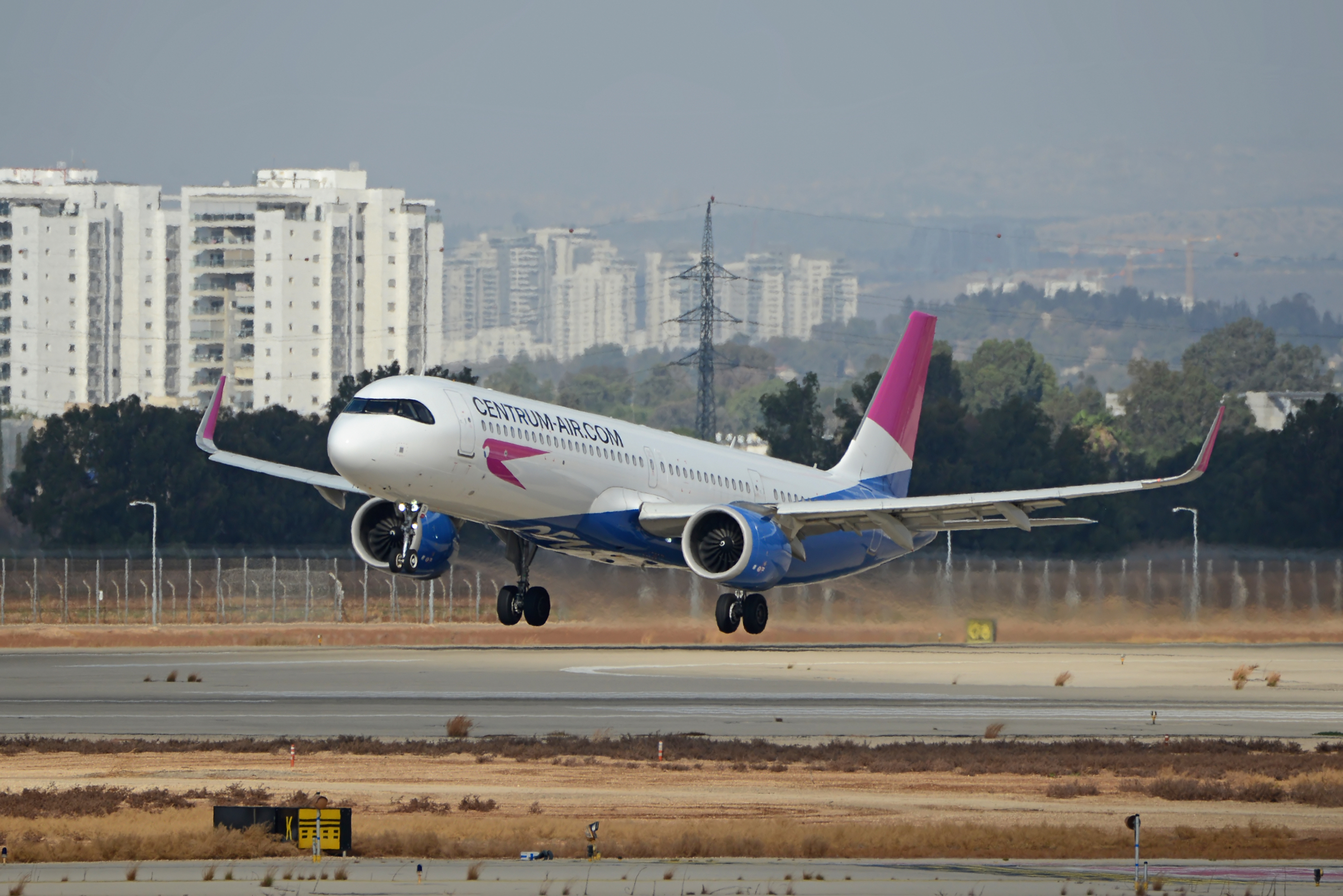 Ben Gurion, Israel – 2025.09.25: Centrum Air Airbus A321-253NX UK32131 take off with city skyline in the background