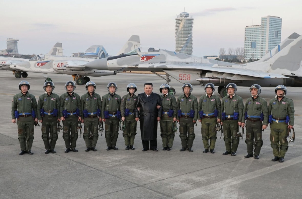 Kim Jong Un with pilots at 80th anniversary of the North Korean Air Force