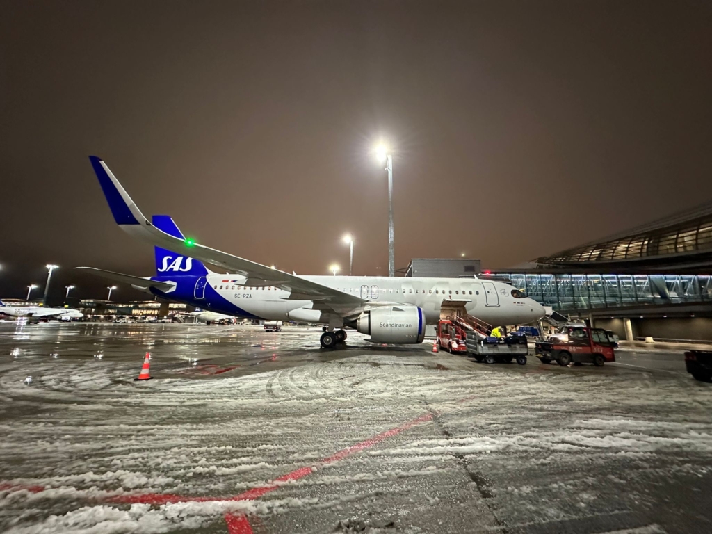 An SAS Scandinavian Airlines aircraft in the snow at Oslo Airport