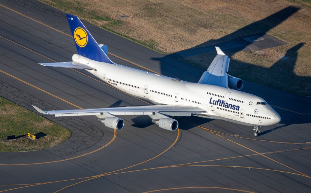 Aerial view of a Lufthansa Boeing 747 taxiing at Boston airport, drone shot