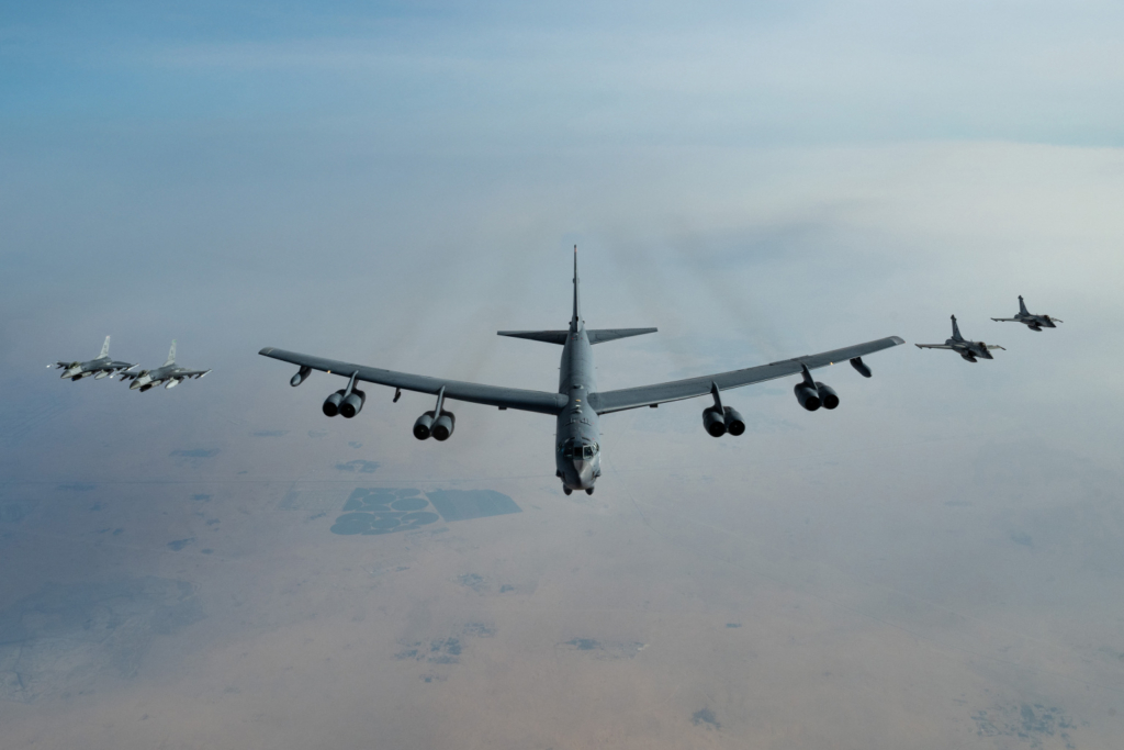 An Air Force B-52 Stratofortress aircraft, assigned to the 96th Expeditionary Bomb Squadron, flies with Qatari Rafale and U.S. F-16 Fighting Falcon fighter jets