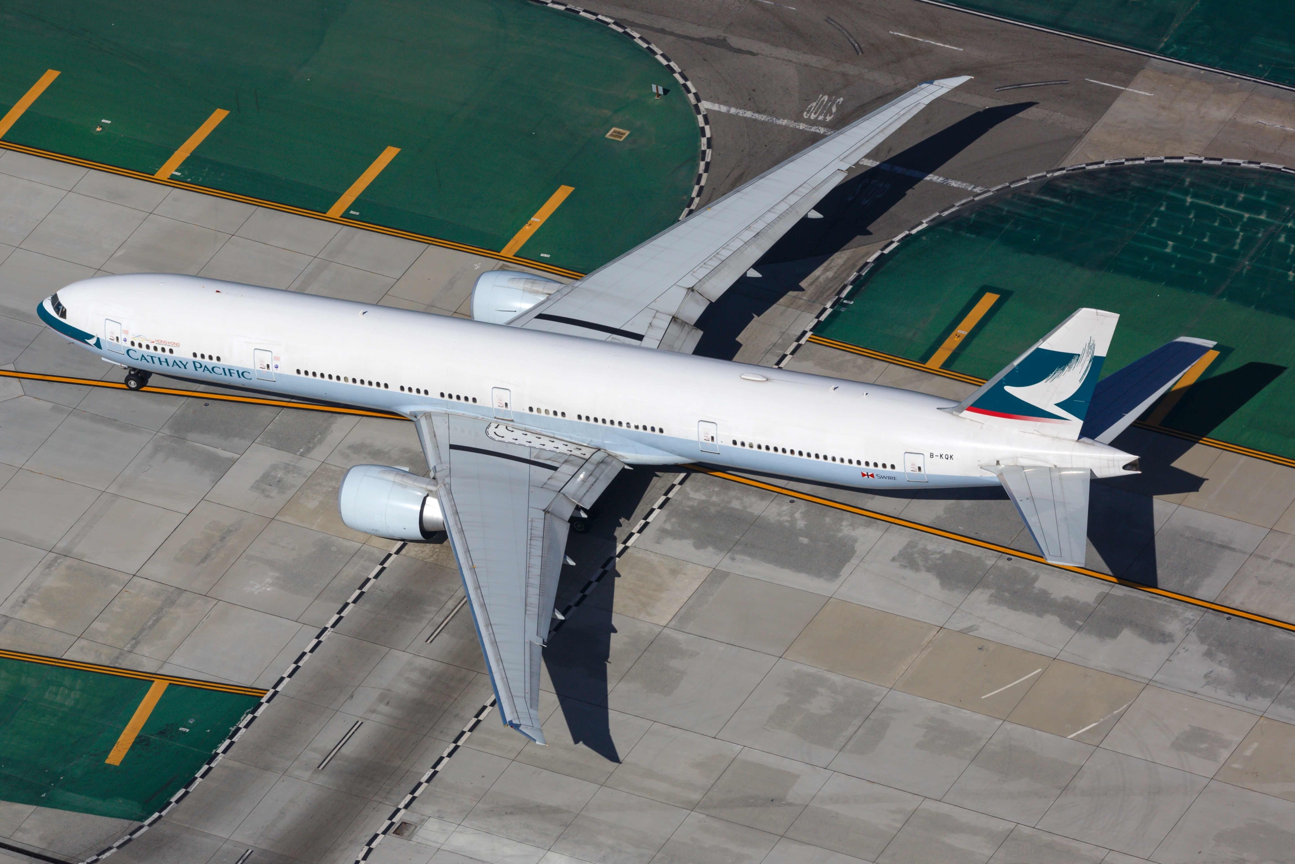 Cathay Boeing 777 with black stripes on wings
