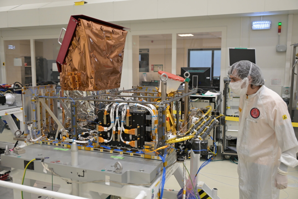 ESA engineer inspecting spacecraft
