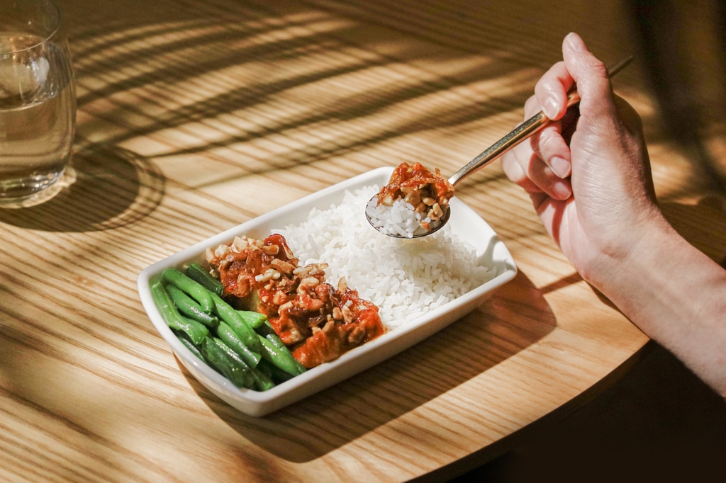 Cathay Pacific Panang dry curry tofu with cashews and coconut rice. 