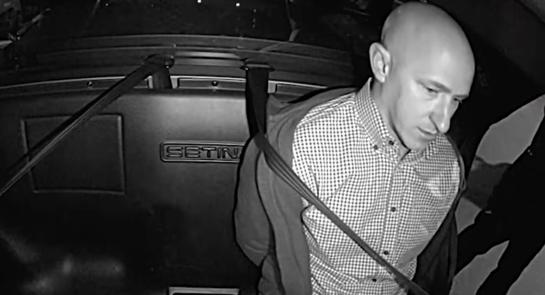 Joseph David Emerson, 46, in the police car