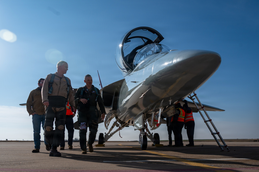 Boeing test pilot, Steve 'Bull' Schmidt (left), and the officer commanding the USAF's 99th FTS, Lt Col Michael 'Hyde' Trott, walk around T-7A Red Hawk (21-7005) shortly after arriving at JBSA-R on 5 December 2025. Image: USAF/Tech Sgt Sean Carnes 