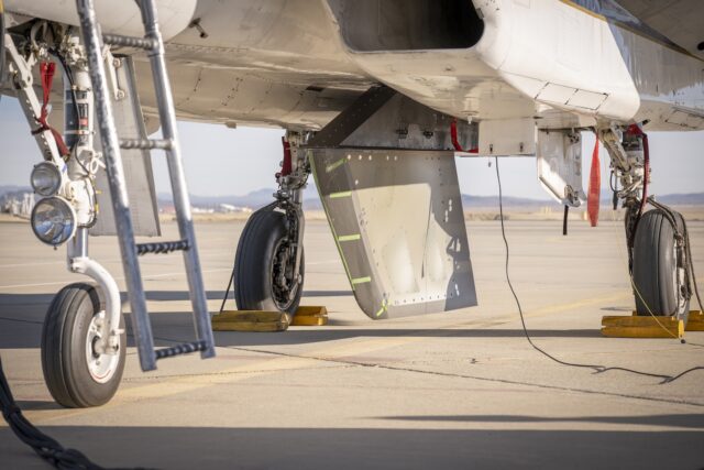 NASA’s Cross Flow Attenuated Natural Laminar Flow test article is mounted beneath the agency’s F-15 research aircraft ahead of the design’s high-speed taxi test