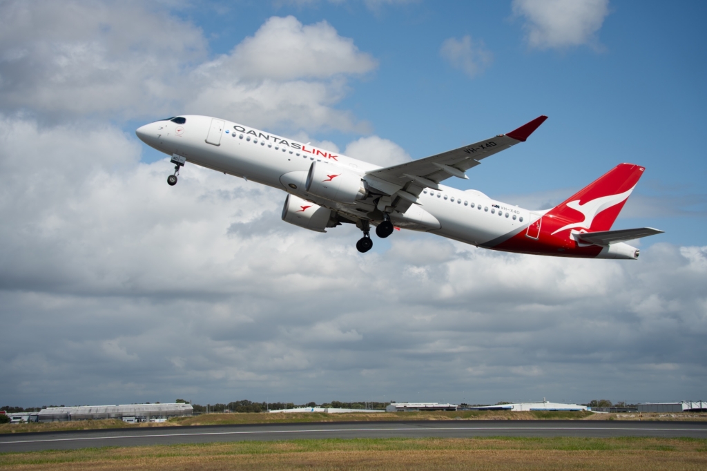 QantasLink A220 taking off from Brisbane Airport on first international flight