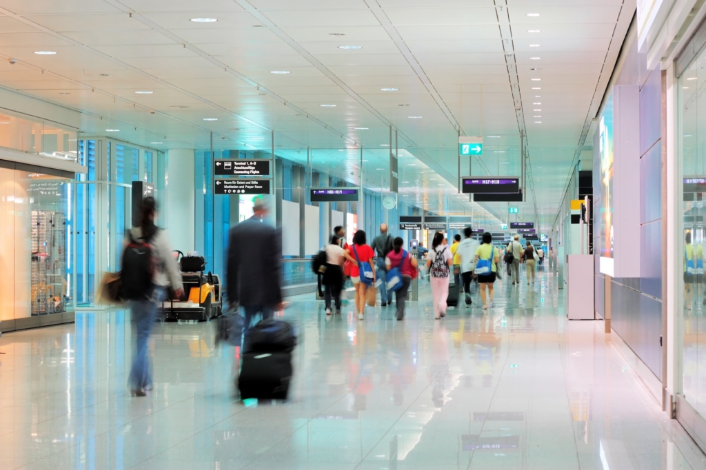 Airport passengers walking through terminal
