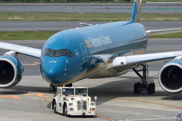 Vietnam Airlines Airbus A350 aircraft taxiing to the gate.