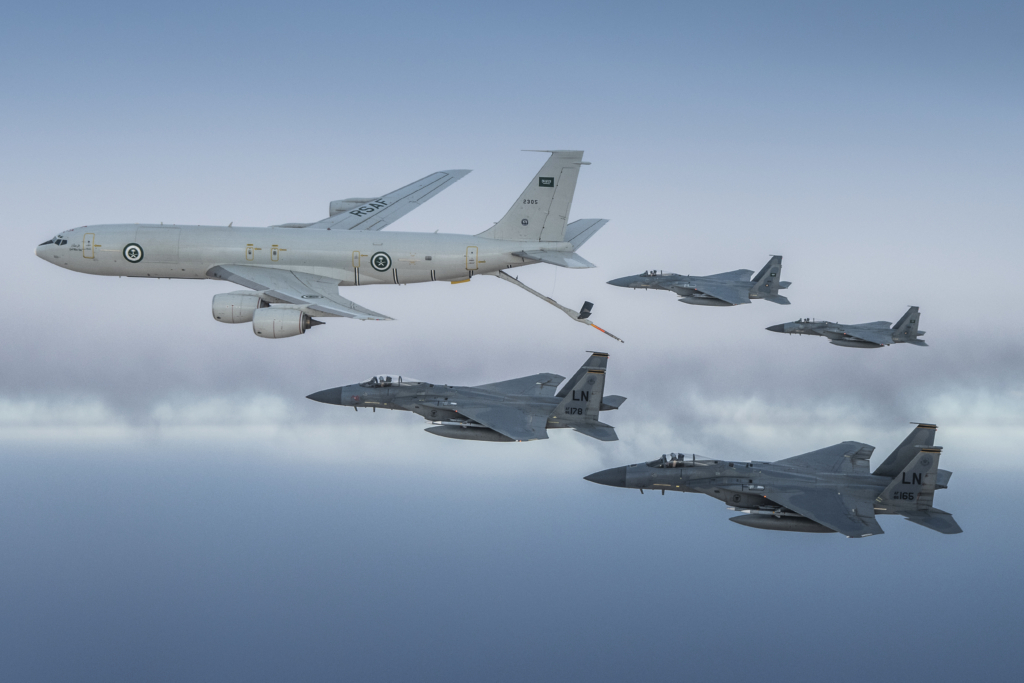 A pair of RSAF-operated F-15Cs and two USAF F-15Cs fly in formation with a Saudi KE-3A tanker aircraft during an air-to-air refuelling mission over the Middle East on 2 June 2019. Image: RSAF