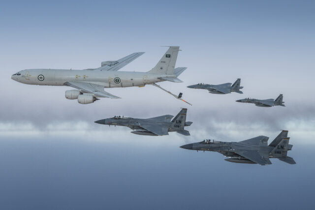 A pair of RSAF-operated F-15Cs and two USAF F-15Cs fly in formation with a Saudi KE-3A tanker aircraft during an air-to-air refuelling mission over the Middle East on 2 June 2019. Image: RSAF