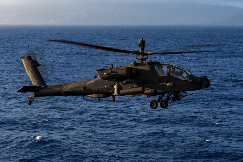 A US Army-operated AH-64E Apache Guardian prepares to land aboard the US Navy's first-in-class amphibious assault ship, USS America (LHA-6), on 11 September 2025. Image: US Navy/Mass Communication Specialist Seaman Nicholas Douglass