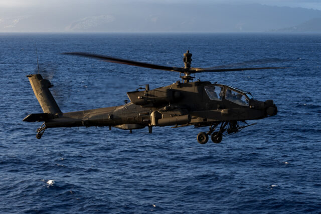 A US Army-operated AH-64E Apache Guardian prepares to land aboard the US Navy's first-in-class amphibious assault ship, USS America (LHA-6), on 11 September 2025. Image: US Navy/Mass Communication Specialist Seaman Nicholas Douglass