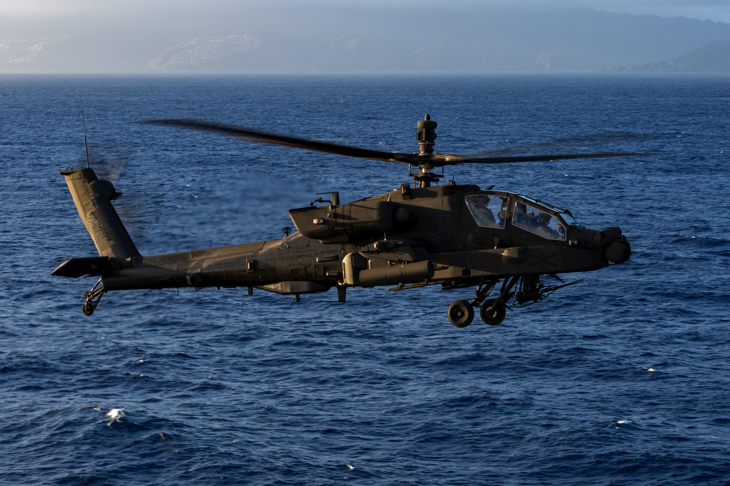 A US Army-operated AH-64E Apache Guardian prepares to land aboard the US Navy's first-in-class amphibious assault ship, USS America (LHA-6), on 11 September 2025. Image: US Navy/Mass Communication Specialist Seaman Nicholas Douglass