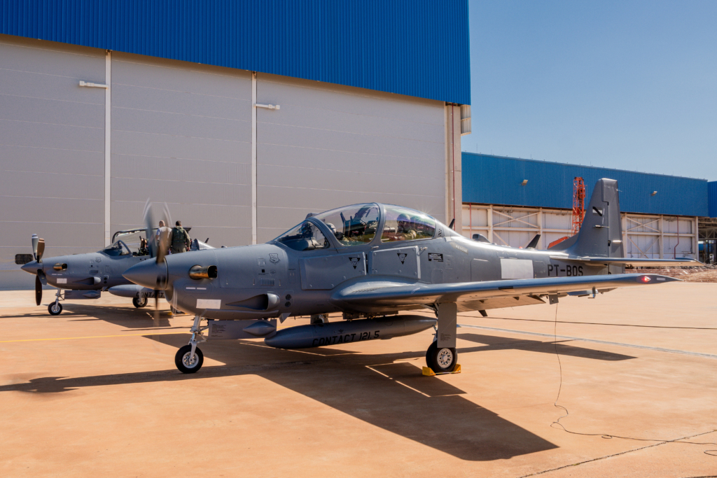 Both of the FAU's first two A-29B Super Tucanos are seen on the ground at Embraer's Gavião Peixoto facility in Brazil shortly before departing on their delivery flight to Uruguay on 17 February 2026. Image: Embraer/Claudio Capucho
